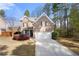 Charming two-story brick home features a well-manicured lawn and an attached two-car garage at 830 Nottingham Se Dr, Smyrna, GA 30082