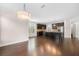 Bright kitchen with modern lighting, dark cabinetry, stainless appliances, and a center island, showcasing open-concept design at 830 Nottingham Se Dr, Smyrna, GA 30082