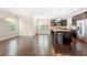 Spacious kitchen with dark wood floors, stainless steel appliances, and a large island with granite countertops at 830 Nottingham Se Dr, Smyrna, GA 30082