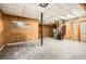 Unfinished basement with wood paneled walls and tile floors at 195 Hermer Nw Cir, Atlanta, GA 30311
