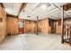 Unfinished basement with wood paneled walls and tile floors at 195 Hermer Nw Cir, Atlanta, GA 30311
