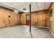 Unfinished basement with wood paneled walls and concrete floors at 195 Hermer Nw Cir, Atlanta, GA 30311