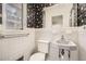 Bathroom featuring white tile walls and vintage floral wallpaper at 195 Hermer Nw Cir, Atlanta, GA 30311