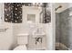 Bathroom featuring white tile walls, shower, sink and vintage floral wallpaper at 195 Hermer Nw Cir, Atlanta, GA 30311