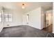 Spacious bedroom with a window, carpet, and an open doorway to a hallway and bathroom at 195 Hermer Nw Cir, Atlanta, GA 30311