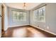 Sunlit bedroom with hardwood floors and natural light from large windows at 195 Hermer Nw Cir, Atlanta, GA 30311