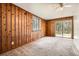 Wood paneled bedroom with sliding glass doors and ceiling fan at 195 Hermer Nw Cir, Atlanta, GA 30311