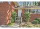 Inviting entrance with stone stairs and a secure metal door at 195 Hermer Nw Cir, Atlanta, GA 30311