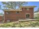 Back of a brick two-story house with a small patio at 195 Hermer Nw Cir, Atlanta, GA 30311