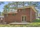 Back of a brick two-story house with a small patio at 195 Hermer Nw Cir, Atlanta, GA 30311