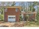 Classic brick house with an attached garage and front entrance stairs at 195 Hermer Nw Cir, Atlanta, GA 30311