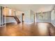 Large living area with hardwood floors, large window and staircase at 195 Hermer Nw Cir, Atlanta, GA 30311