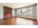 Cozy living room features a brick fireplace and hardwood floors at 195 Hermer Nw Cir, Atlanta, GA 30311