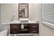 Modern bathroom featuring a sleek vessel sink, contemporary vanity, and ample natural light from the window at 3021 San Juan Dr, Decatur, GA 30032