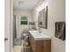 Bright bathroom featuring a modern vanity with a vessel sink, a framed mirror and natural light from the window at 3021 San Juan Dr, Decatur, GA 30032