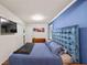 Spacious bedroom featuring blue walls, hardwood flooring, and natural light at 3021 San Juan Dr, Decatur, GA 30032