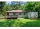 Back exterior featuring a well-maintained yard and a cozy deck, enhancing outdoor living at 3021 San Juan Dr, Decatur, GA 30032