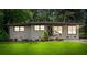 Alluring home with freshly painted brick, neatly trimmed shrubs, and a vibrant green lawn at 3021 San Juan Dr, Decatur, GA 30032
