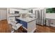 Bright kitchen with white cabinets, stainless steel appliances, granite countertops, and a stylish island at 3021 San Juan Dr, Decatur, GA 30032