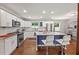 Contemporary kitchen featuring stainless appliances, a center island, and white cabinetry at 3021 San Juan Dr, Decatur, GA 30032
