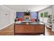 Modern living room with a fireplace, mounted TV, hardwood floors, and ample space at 3021 San Juan Dr, Decatur, GA 30032