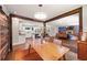 Open-concept living and dining area with hardwood floors, modern lighting, and a sliding barn door at 3021 San Juan Dr, Decatur, GA 30032