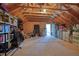 Spacious unfinished attic with exposed wood beams and ample storage space at 4105 Brookview Dr, Cumming, GA 30040