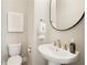 Elegant powder room featuring modern fixtures, vanity sink, and stylish mirror at 4105 Brookview Dr, Cumming, GA 30040