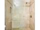 Elegant bathroom featuring a tiled shower with glass door and brushed nickel fixtures at 4105 Brookview Dr, Cumming, GA 30040