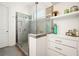 Beautiful bathroom showcasing a sleek glass shower and vanity space with decorative shelving at 4105 Brookview Dr, Cumming, GA 30040
