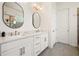 Bathroom boasts double vanity with modern fixtures and a glass shower, offering a spa-like feel at 4105 Brookview Dr, Cumming, GA 30040