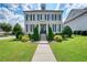 Charming two-story home with a well-manicured lawn and landscaped garden at 4105 Brookview Dr, Cumming, GA 30040
