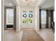 Bright foyer with hardwood floors and stylish double entry doors at 4105 Brookview Dr, Cumming, GA 30040