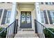 Elegant entryway with double doors and classic brick steps at 4105 Brookview Dr, Cumming, GA 30040