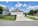 Shot of a detached two car garage with a long driveway leading to the street on a clear day at 4105 Brookview Dr, Cumming, GA 30040