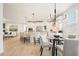 Bright kitchen featuring a large island, stainless steel appliances, and an adjacent dining area at 4105 Brookview Dr, Cumming, GA 30040