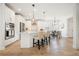 Bright, open kitchen with white cabinets, stainless steel appliances, and a dining area at 4105 Brookview Dr, Cumming, GA 30040