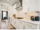 Detailed view of kitchen with white cabinets, stone backsplash, and modern appliances at 4105 Brookview Dr, Cumming, GA 30040