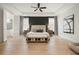 Spacious main bedroom featuring a tray ceiling, large windows, and modern furnishings at 4105 Brookview Dr, Cumming, GA 30040