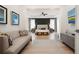 Spacious main bedroom featuring a tray ceiling, a sitting area, and modern furnishings at 4105 Brookview Dr, Cumming, GA 30040