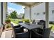Covered patio with outdoor dining set and lush landscaping at 4105 Brookview Dr, Cumming, GA 30040