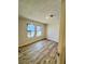 Cozy bedroom with new flooring, neutral paint, and natural light from multiple windows at 383 Third Ave, Scottdale, GA 30079