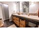 Stylish bathroom with double sinks, rustic vanity, and exposed ductwork giving it an industrial-chic feel at 490 Marietta Nw St # 101, Atlanta, GA 30313
