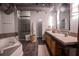 Spacious bathroom with double vanity, soaking tub, walk-in shower and industrial-style ductwork at 490 Marietta Nw St # 101, Atlanta, GA 30313