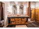 Bathroom with double vanity, exposed wood beams, stylish mirrors and ample storage at 490 Marietta Nw St # 101, Atlanta, GA 30313