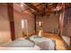 Spacious bedroom featuring exposed wood beams, hard wood floors, and interior doors leading to adjacent rooms at 490 Marietta Nw St # 101, Atlanta, GA 30313