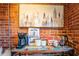 Cozy coffee bar area featuring a brick wall, coffee maker, snacks and appealing artwork at 490 Marietta Nw St # 101, Atlanta, GA 30313