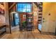 Hallway with wooden floors, brick accent wall, large mirror, and access to a small utility room at 490 Marietta Nw St # 101, Atlanta, GA 30313