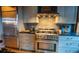 Modern kitchen showcasing stainless steel appliances, granite countertops, and stylish gray cabinetry at 490 Marietta Nw St # 101, Atlanta, GA 30313