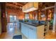Modern kitchen with a double sink, open layout, wooden floors, and exposed brick walls and wooden beams at 490 Marietta Nw St # 101, Atlanta, GA 30313